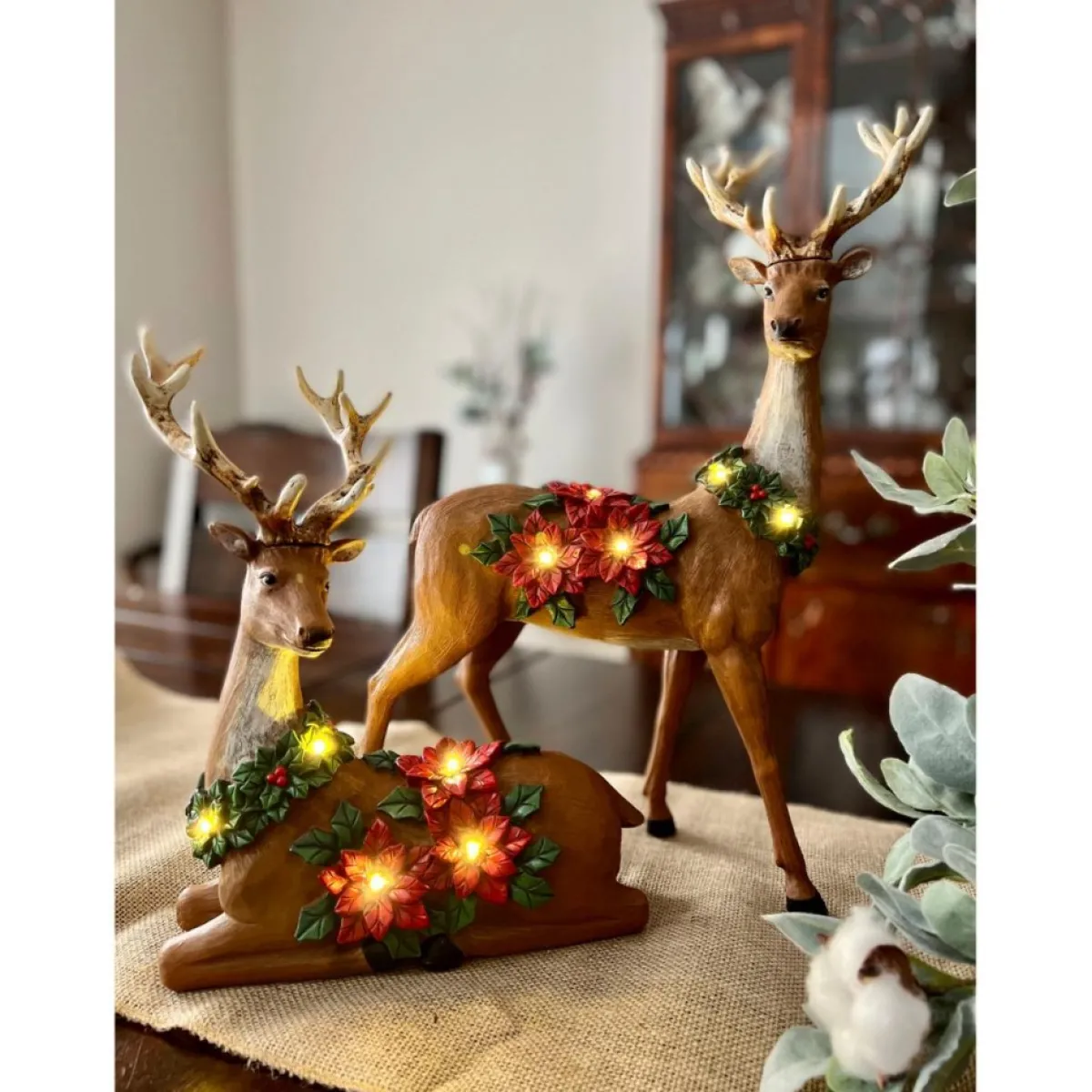 winter_lane_piece_illuminated_reindeer_with_poinsettias_3.webp Winter Lane Indoor Decor | 2-Piece Illuminated Reindeer With Poinsettias